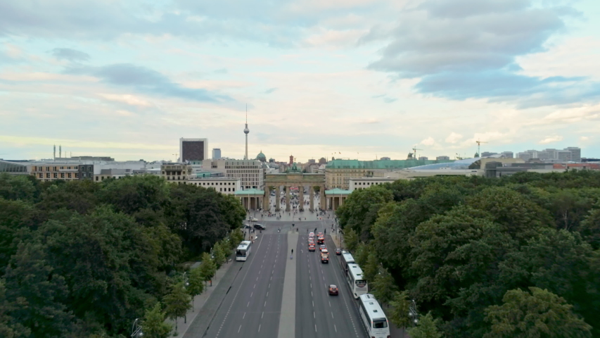 Aerial View of Brandenburg Gate (Brandenburger Tor) in Capital of Germany, Europe. Berlin Skyline at the Background. 4K Zoom Shot of European City Landmark
