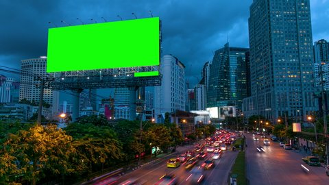 4k timelapse day to night of light trails in road to Asoke district at the center of heart business district in Bangkok city downtown Thailand