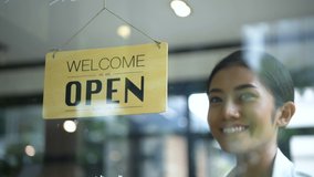 Coffee shop concept. The waitress is opening a coffee shop in bright. 4k Resolution. - Powered by Shutterstock - Get 15% off with code: PIKWIZARD15