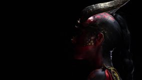 Woman demon with red skin and big horns on her head, close up - Powered by Shutterstock - Get 15% off with code: PIKWIZARD15