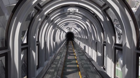 Osaka,Japan. May,10th,2019. View from the modern Umeda Sky Building. Electric escalator structure , going down stairs perspective. Light and shadows. Futuristic architecture. Symmetry. Nobody.