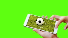 man hand hold and touch screen smartphone isolated on green screen   with football field on screen,abstract background to sport football or soccer online gambling.