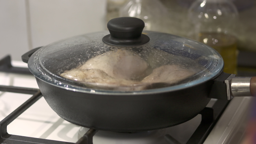woman making pan fried chicken legs Stock Footage Video (100% Royalty