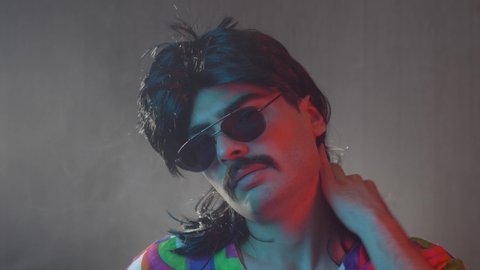 A man from the 70s 80s 90s with a mustache and a mullet hairstyle. Retro concept