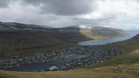 Flight over the city of Klaksvik on Bordoy island in the Faroe Islands, Denmark. 4K UHD video.