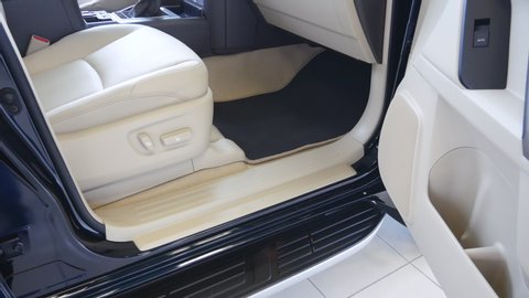 Luxury SUV car interior, dashboard with leather seats and upholstery