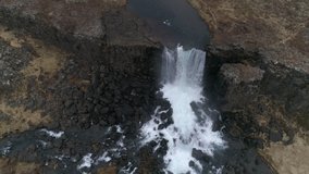Aerial footage of Oxararfoss waterfall in Thingvellir in Iceland. shot in spring