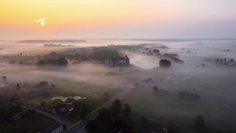 Timelapse: Mir Castle in Belarus on a foggy summer morning from a drone