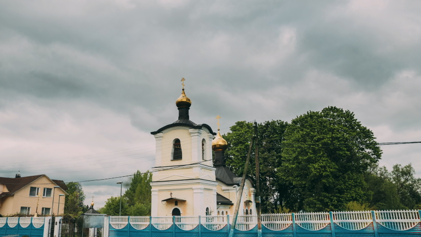 Zheleznyaki, Vetka District, Gomel Region, Belarus. Belfry And Church Of St Nicholas The Wonderworker In Sunny Spring Or Summer Day. Orthodox Church Of St. Nikolaya Chudotvortsa