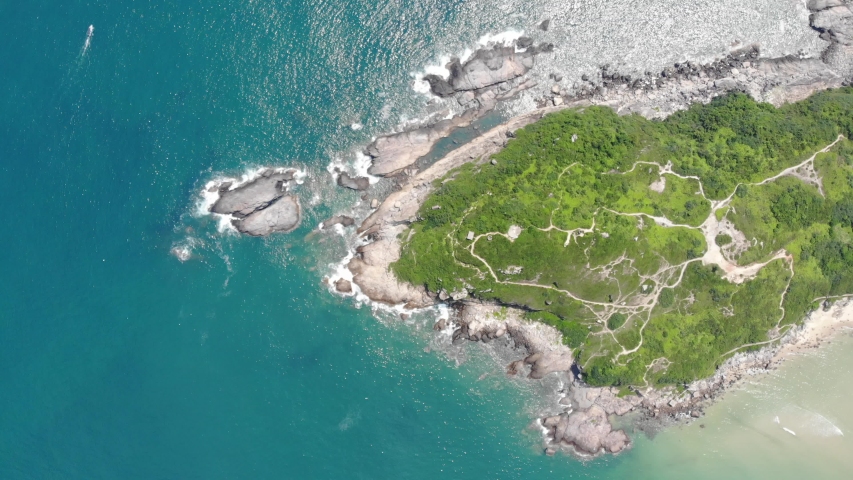 Spectacular Dong Chong beach with clean turquoise water and big enough waves for surfing and diving. Green and beautiful hills and caves around. Shenzhen, China.