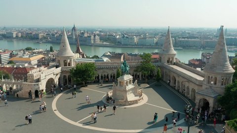 Budapest, Hungary - 4K drone flying at Fisherman's Bastion by Matthias Church with Parliament of Hungary at background on a sunny summer day