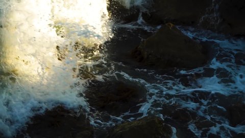 Sea Waves Hit Rocks and Stones with Splashes in Slow Motion