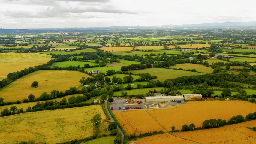 Aerial drone view of Irish countryside and farmlands near the Carlow in Dublin county, Ireland. Rural Irish landscape.