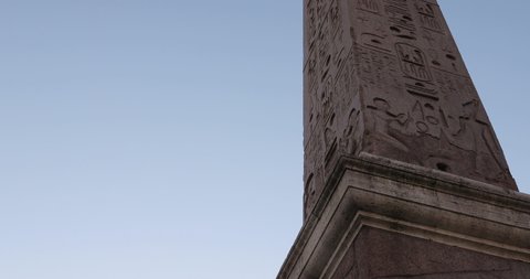 Rome / Italy - 03 29 2019: Egyptian ancient writing hieroglyphics symbols and pharaohs on obelisk