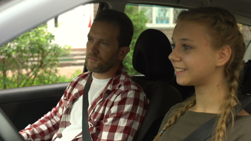 My father drive. Teaching to Drive. Dad Driving his daughter to School.