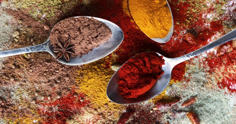 Different kind of spices in spoons. Top view, flat lay