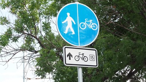 Sign on road cycle pedestrian alley