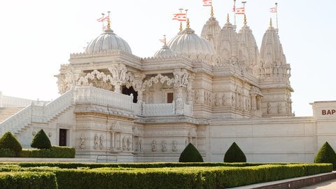 LONDON, circa 2019 - High key shot of the BAPS Shri Swaminarayan Mandir Hindu temple in Neasden, London, one of the largest Hindu temples outside India