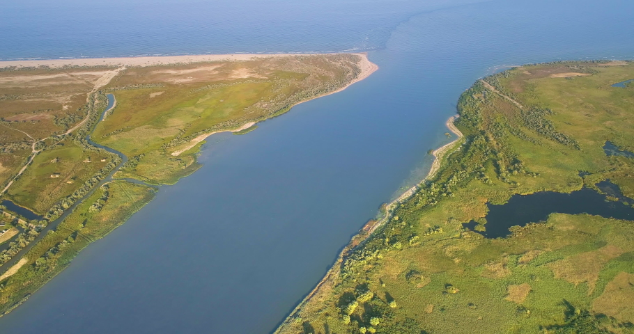 Aerial View of Danube River Mouth Flowing into the Black Sea, Sfantu Gheorghe, Romania Royalty-Free Stock Footage #1036409846