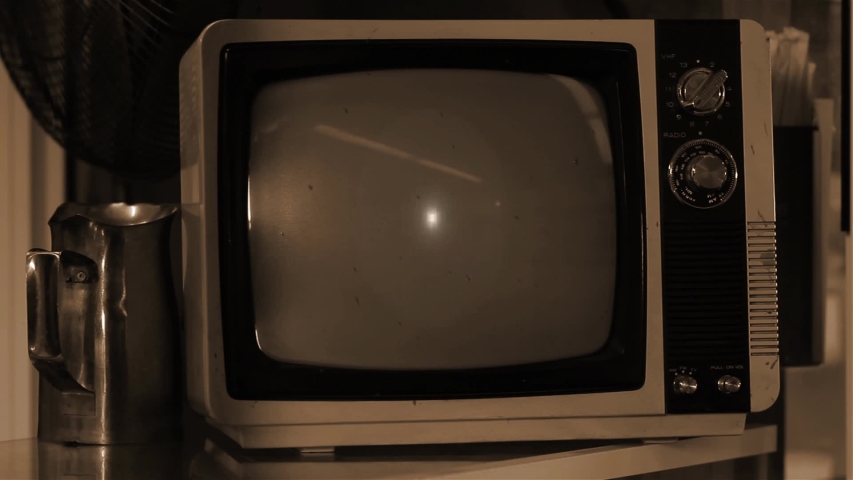 Ancient Portable TV Set Turning On and Off Green Screen. Sepia Tone. Zoom In. You can replace green screen with the footage or picture you want. You can do it with “Keying” effect in After Effects. Royalty-Free Stock Footage #1036410434