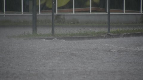 Kranj / Slovenia - 07 09 2019: Car drives by during heavy flood rain