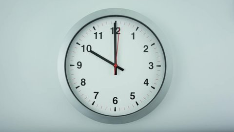 Gray wall clock beginning of time 10.00 am or pm. on white background, Time lapse 60 minutes moving fast, Time concept.