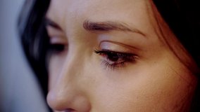 cropped view of crying and attractive woman