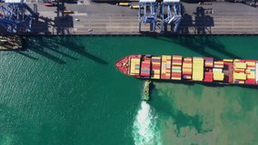 footage aerial top view seaport loading and unloading shipping cargo container import and export international open sea  