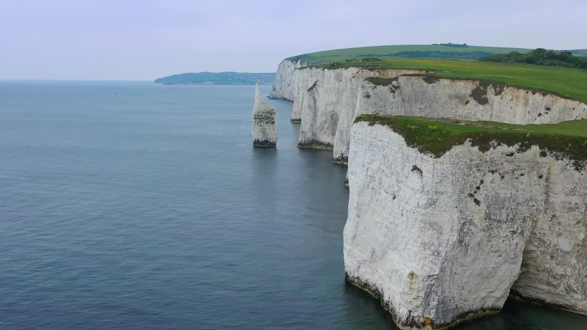 ENGLAND - CIRCA 2018 - Beautiful aerial over the white cliffs of Dover near Old Harrys Rocks on the south coast of England. Royalty-Free Stock Footage #1036432052