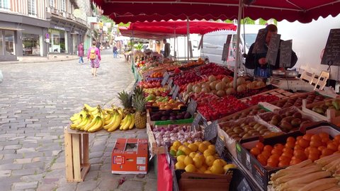 HONFLEUR, FRANCE - CIRCA 2018 - Fresh fruits and vegetables from farm to table in a street market in Honfleur, France.