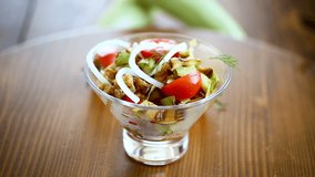 warm grilled zucchini salad with fresh cherry tomatoes and onions