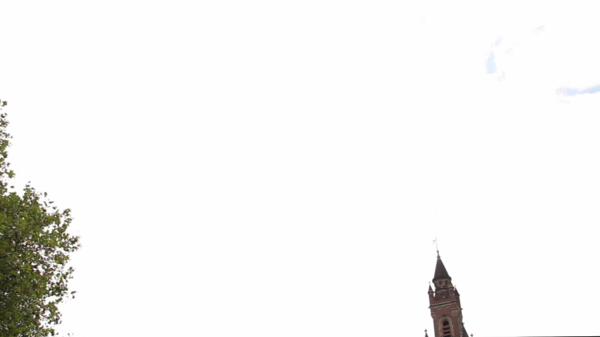 Tilting down from sky to Peace Palace in The Hague. It houses the International Court of Justice and is a popular tourist attraction in the Netherlands.