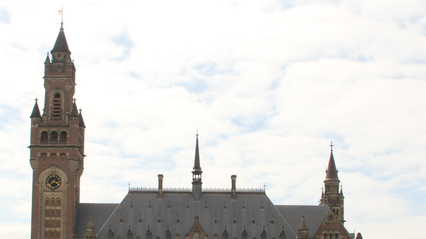 Time lapse of international court of justice The Hague - Peace Palace - wide - zoom out. It houses the International Court of Justice and is a popular tourist attraction in the Netherlands.