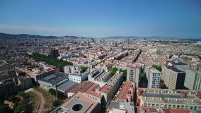 Aerial video of downtown Barcelona in Spain on a beautiful sunny day with a wide angle lens. June 2018