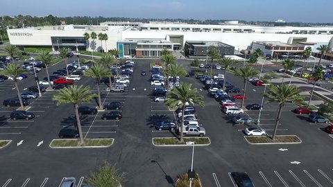 Torrance , CA / United States - 09 14 2017: Torrance, California, 14 September 2017 - Aerial Drone slowly flying across Del Amo Fashion Center parking lot and shops