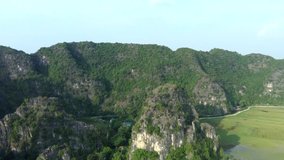 Aerial drone footage of mountains of Tam Coc, Vietnam.