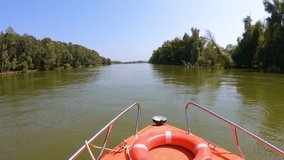 High speed boat navigating in the Sfantu Gheorghe arm of Danube river, Romania, hyper lapse video