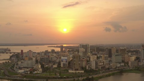 Africa, Ivory Coast, Abidjan, drone aerial view above the city center during the sunset