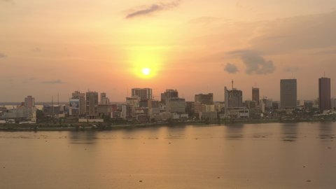 Africa, Ivory Coast, Abidjan, drone aerial view above the city center during the sunset