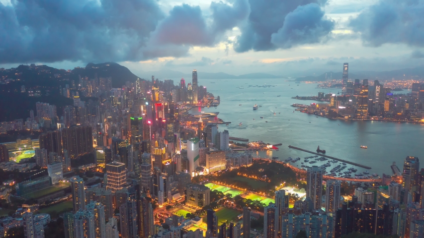 Aerial drone hyper lapse or time lapse over Hong Kong at night. Central distinct of Hong Kong shot by 4K resolution drone, Victoria Harbor, Hong Kong | Shutterstock HD Video #1036450826