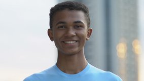 Glad afro-american male teen smiling on camera, volunteer project, motivation - Powered by Shutterstock - Get 15% off with code: PIKWIZARD15