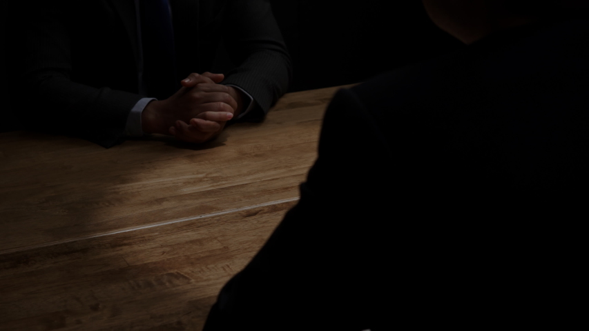 Dishonest businessman secretly giving money to his partner in the dark room for bribery scam and corruption concepts Royalty-Free Stock Footage #1036483463