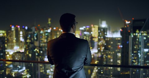 Young Businessman Looking At City Sky Scrapers Urban Landscape Entrepreneurship Urban Night Lights Slow Motion Red Epic 8k