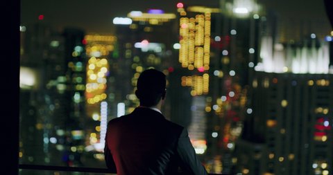 Young Businessman Looking At City Sky Scrapers Rooftop Urban City View Finance Leadership Night City Lights Slow Motion Red Epic 8k