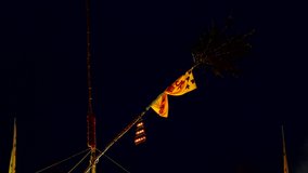 The bamboo stick with nine oil lamps be hoisted highly on the pole at chinese  shrine signed the start of vegetarian festival in Phuket,4K video.
Vegetarian festival. 