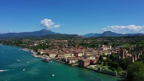 Aerial video with drone. Beautiful view of the city of Lazise, Italy. Garda lake.