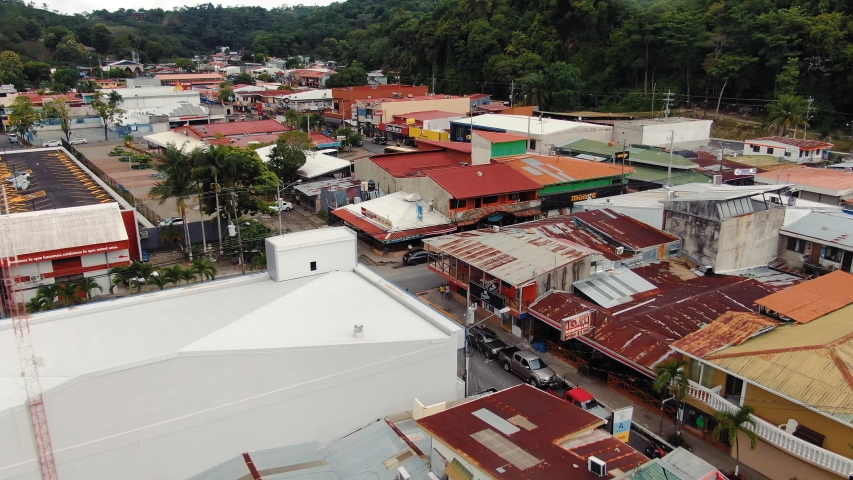 Drone Footage of Business Buildings in Downtown Quepos, Costa Rica on a Cloudy Day, Camera Dolly-In