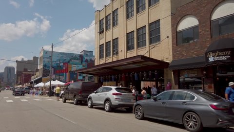 Pittsburgh , Pennsylvania / United States - 07 27 2019: Lined with converted warehouses, the hip Strip District has a vibrant mix of old-style grocers and gourmet food shops, street stands selling pro