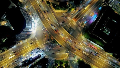 Aerial view of traffic circle - Traffic concept image, gongguan traffic circle birds eye night view use the drone at night in Taipei, Taiwan.