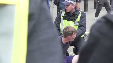 london / United Kingdom (UK) - 08 03 2019: A Tommy Robinson supporter is arrested by police along Whitehall, London. 08/03/19